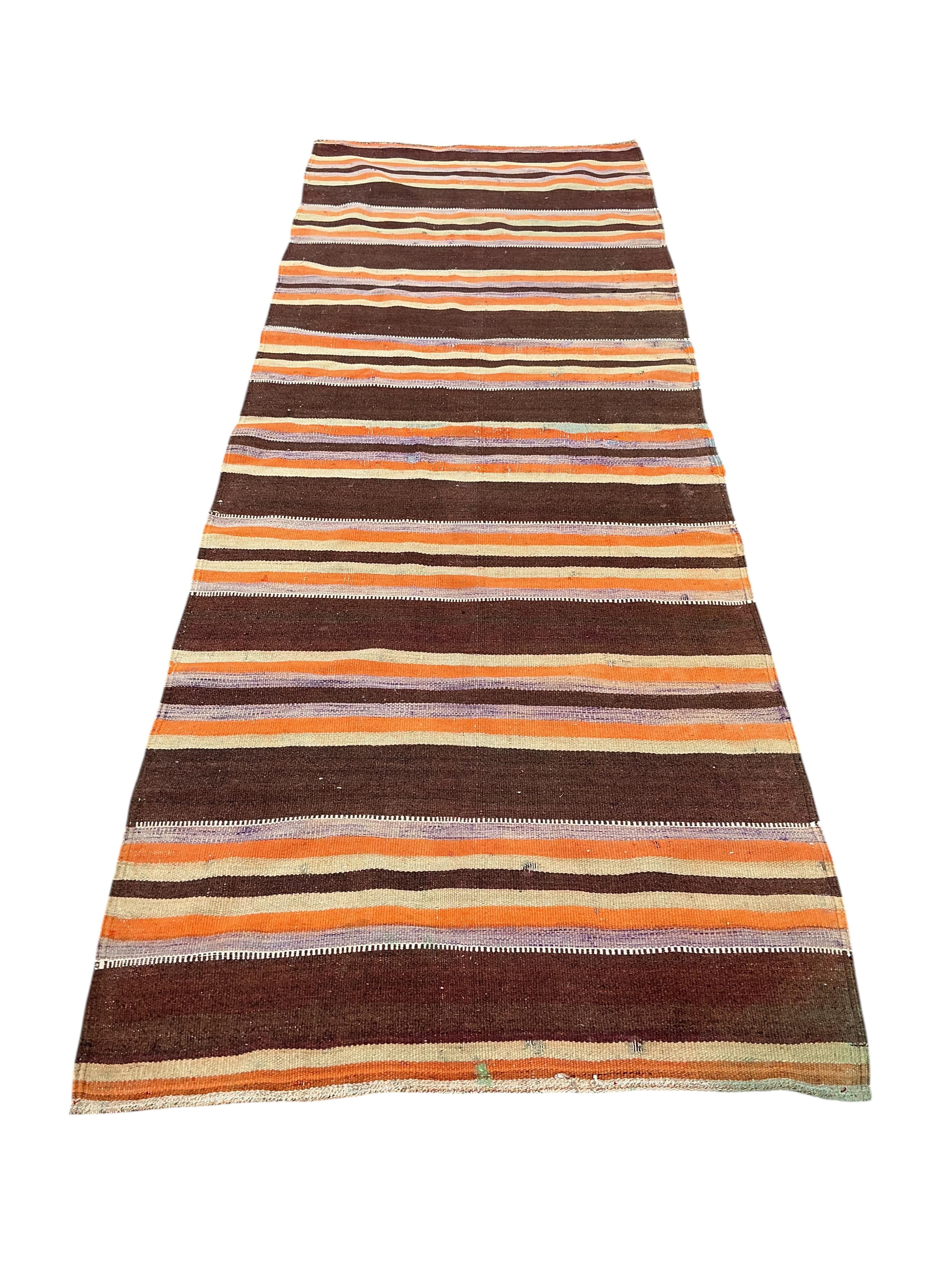 A Turkish kilim hall carpet, 340 x 120cm